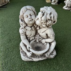 Statue Girl Boy Kissing